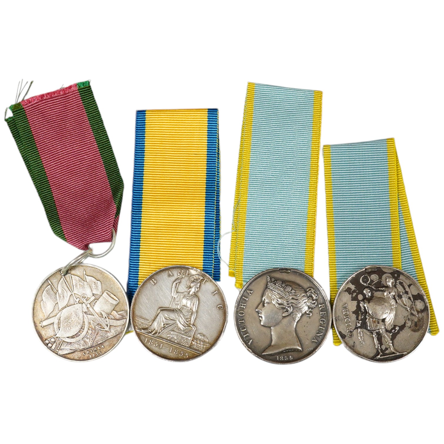 Two Crimea medals, a Baltic medal, all disc only and unnamed with a replica Turkish Crimea medal, unnamed, (3).